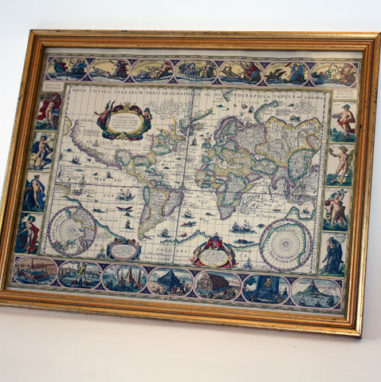 framed antique map with decorative illustrations around the border of map