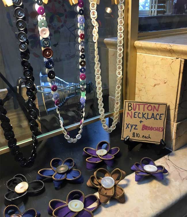 zippers and buttons crafted into jewelry