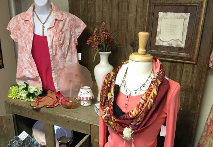 women's blouses and accessories on display at Second Street Thrift Store