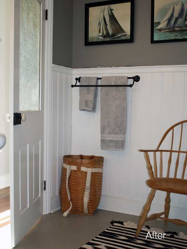 updated old house bathroom with vintage hand colored racing yacht photos on the gray painted walls