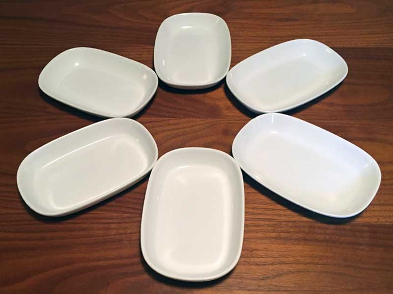 six white vintage airline dishes